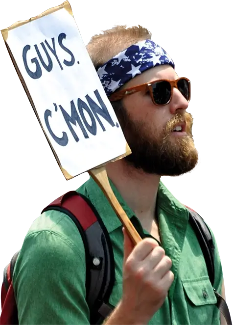 Photo of a climate march focusing on one man holding a sign 'Guys, C'mon'.
